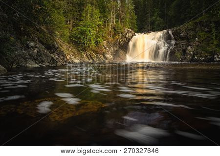 Long Exposure Shot Of Flowing River Homla And Waterfalls.