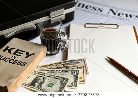 Key Of Success With Notbook , Briefcase
 , Dollas And Coffee.business Concepts.