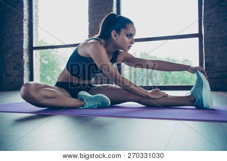 Profile Side View Of Nice Attractive Focused Concentrated Sportive Girl Sitting On Carpet, Floor, Pr
