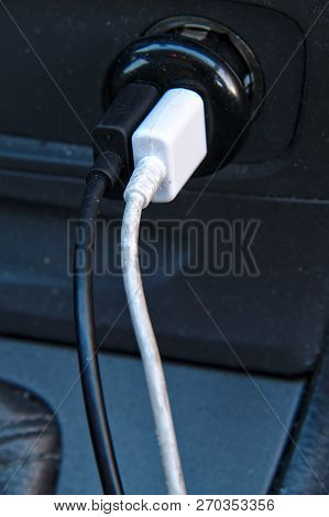 Two Charging Cables Coming From 12v Usb Charger Of A Car.