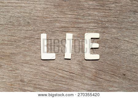 Alphabet Letter In Word Lie On Wood Background
