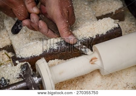 Carpenter working on woodworking machines in carpentry shop. Joiner carpenter workplace. Handmade an