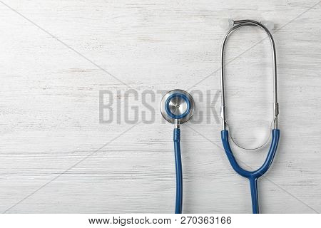 Stethoscope For Checking Pulse And Space For Text On Light Background, Top View