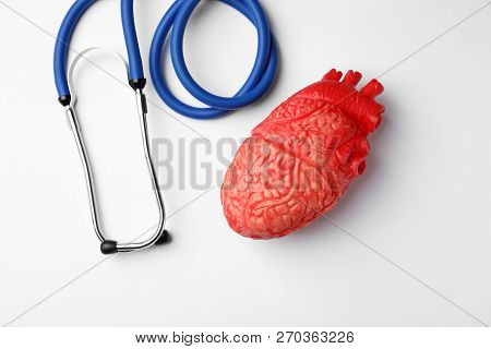 Stethoscope For Checking Pulse And Heart Model On White Background, Top View