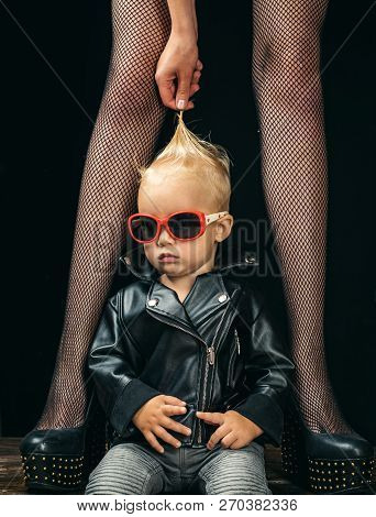 Forever Rocker. Rock And Roll Fashion Trend. Small Boy At Female Legs. Rock Style Child. Cute Little