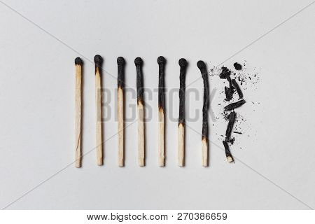 Concept Of Patience. A Row Of Burnt Matches, From Left To Right, From Almost A Whole Match To A Comp