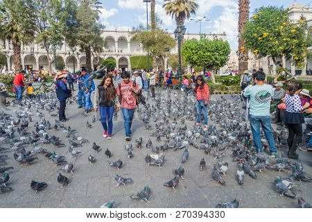 Arequipa, Peru - May 26, 2015: People And Pigeons At Plaza De Armas Square In Arequipa, Peru.
