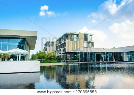 Ajman, United Arab Emirates - 30 October 2018: Landscape With Modern Design Buildings, Lagoon Pool A