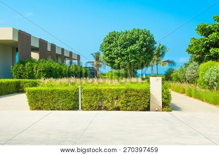 Ajman, United Arab Emirates - 30 October 2018: Landscape With Modern Design Villas And Garden In A L