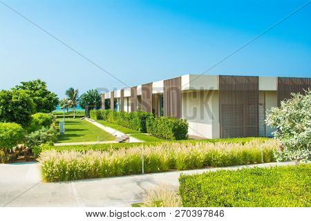 Ajman, United Arab Emirates - 30 October 2018: Landscape With Modern Design Villas And Garden In A L