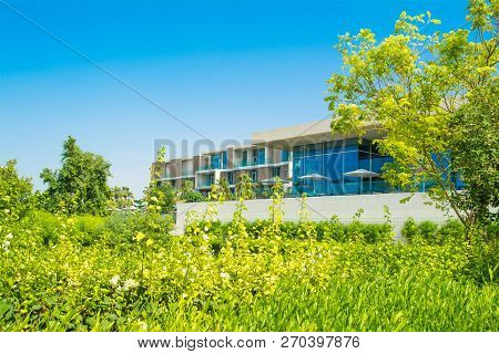 Ajman, United Arab Emirates - 30 October 2018: Landscape With Modern Design Restaurant Building And 