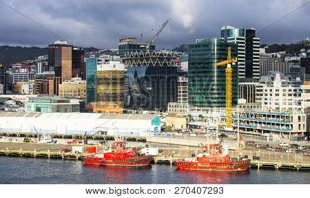 Wellington, New Zealand - August 24, 2017: Cityscape View Of The Capital City Including Two Red Tug 