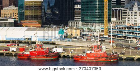 Wellington, New Zealand - August 24, 2017: Cityscape View Of The Capital City Including Two Red Tug 