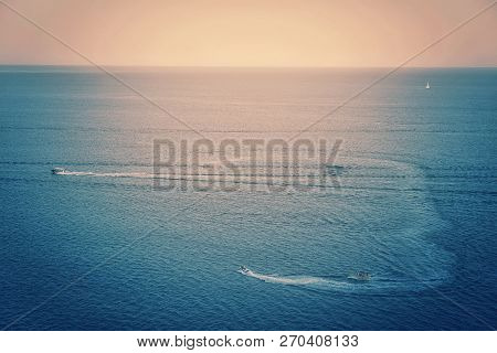 Sunset Time Over Blue Orange Black Sea Background