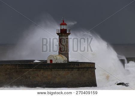 Big Storm With Big Waves Near A Lighthouse