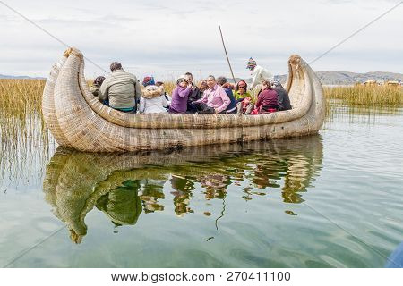 Titicaca, Peru - May 15, 2015: Visitors On A Reed Boat Near Uros Floating Islands, Titicaca Lake, Pe