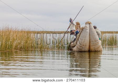 Titicaca, Peru - May 15, 2015: Visitors On A Reed Boat Near Uros Floating Islands, Titicaca Lake, Pe