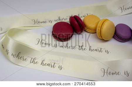 Macaroon Close-up With Decorative Ribbon Isolated On Light Background.