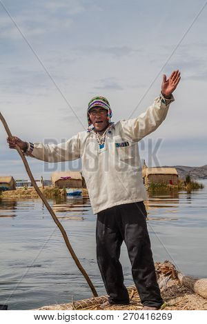 Titicaca, Peru - May 15, 2015: Boatman, Inhabitant Of Uros Floating Islands, Titicaca Lake, Peru