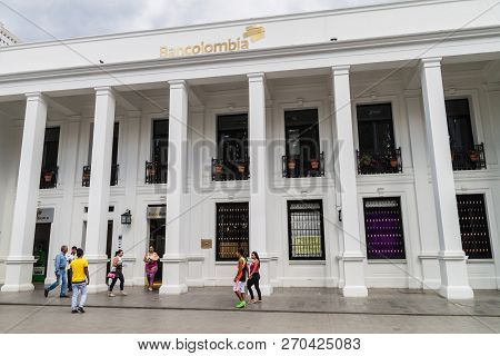 Popayan, Colombia - September 10, 2015: People In Parque Caldas In Front Of Bancolombia Bank Buildin