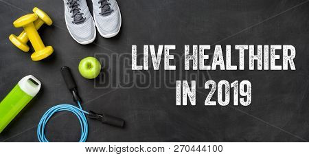Live Healthier In 2019 Written On A Blackboard