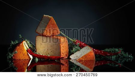 Red Pecorino Sheep Milk Cheese With Thyme And Red Pepper.