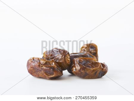 Dried Halawi Dates On A White