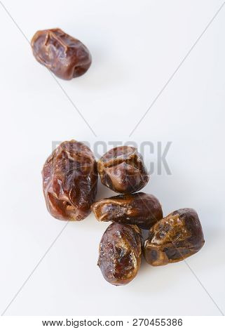 Dried Halawi Dates On A White