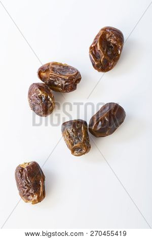 Dried Halawi Dates On A White