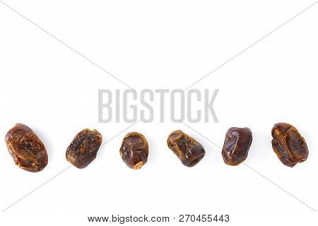 Dried Halawi Dates On A White