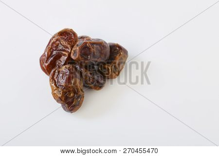 Dried Halawi Dates On A White