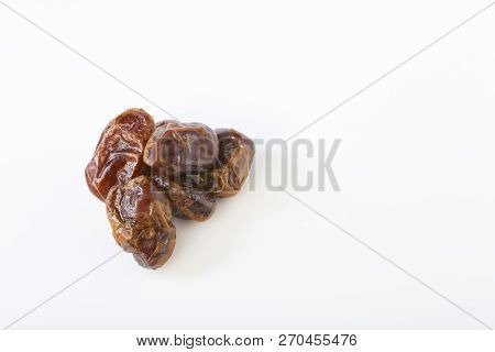 Dried Halawi Dates On A White