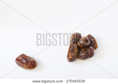 Dried Dates (fruits Of Date Palm Phoenix) On A White Background.