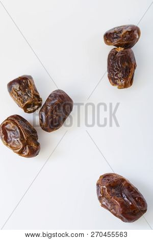 Dried Dates (fruits Of Date Palm Phoenix) On A White Background.