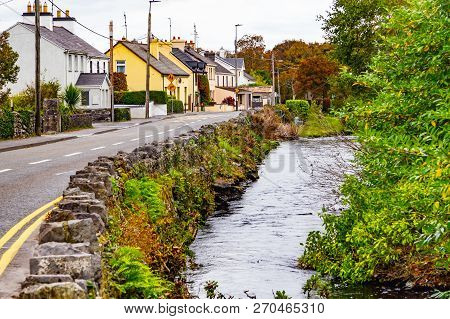 Owenriff River With Houses And Forest, Oughterard, Ireland