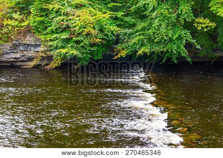 Trees And Reflection In Owenriff River