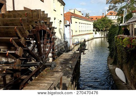 Prague, Czech Republic - October 04, 2018:  Chertovka River In Prague With An Old Water Wheel And Aq