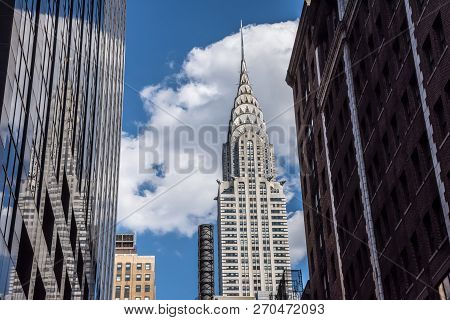 New York-july 22: The Iconic Chrysler Building Frames By Surrounding Buildings On A July 22 2015 In 