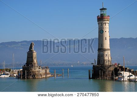 Harbour Entrance Of Lindau,  Lake Constance (german: Bodensee) With The New Lighthouse And The Bavar