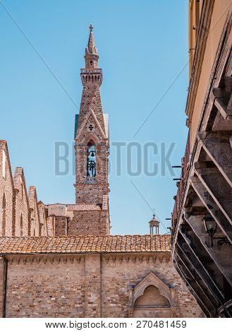 High Narrow Tower With Bell In The Florence Town