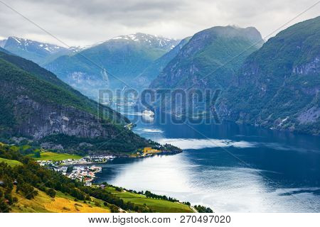 Breathtaking view of Sunnylvsfjorden fjord and cruise ship, near Geiranger village in western Norway.