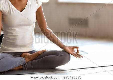 Young Sporty Black Woman Practicing Yoga, Doing Easy Seat Exerci