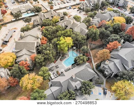 Aerial View Apartment Building With Swimming Pool And Colorful Fall Foliage