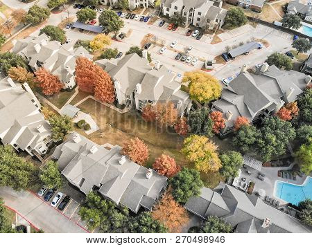 Aerial View Apartment Building With Swimming Pool And Colorful Fall Foliage