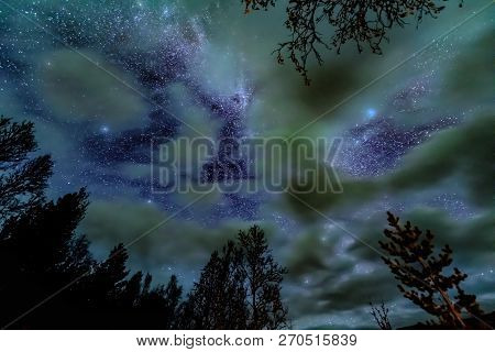 Amazing Photo Of The Milky Way Galaxy Behind Clouds - Above Forest ( Tree Line )