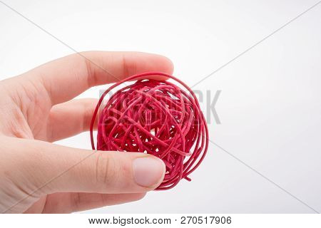 Roll Of Colotful String In The Hand