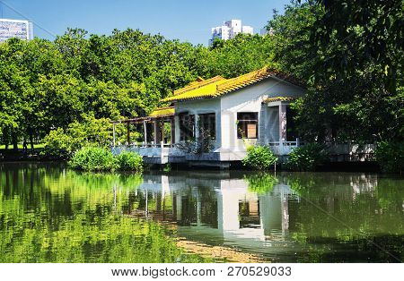 A Chinese Style Building On A Lake In Lizhi Park In Futian District Shenzhen China On A Sunny Day.