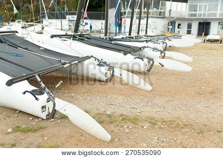 Morgat, France 29 May 2018 Catamarans Storage Without Sails Parked On The Beach.