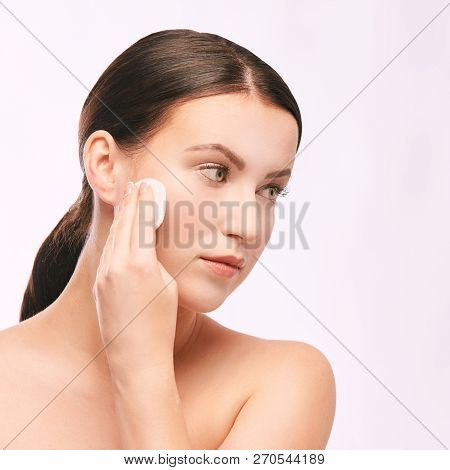 Young Girl Remove Cosmetic From Face. Skin Care With Cotton Pad