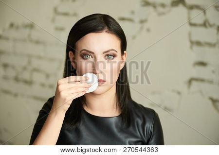 Young Girl Remove Mascara. Face With Cotton Pad